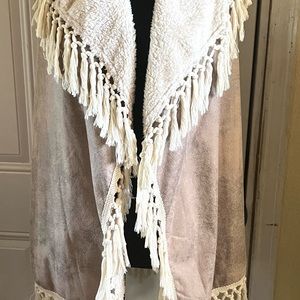 Vest in suede for outer material and warm inner lining.  Size L